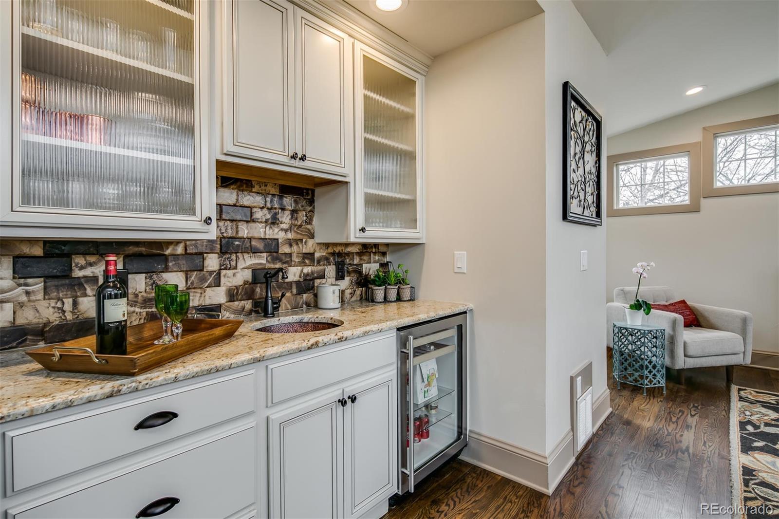 515 East Iliff Avenue Denver, CO 80210 - Photo 14 of 35 a kitchen with stainless steel appliances granite countertop a stove and cabinets