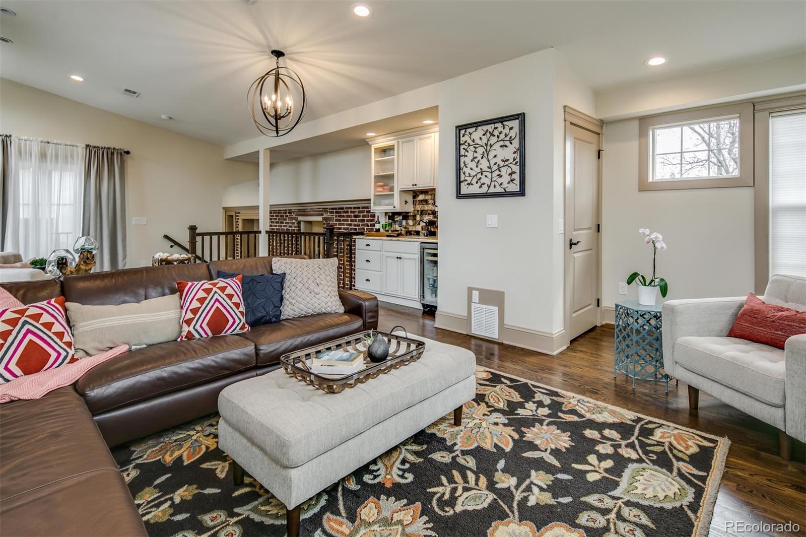 515 East Iliff Avenue Denver, CO 80210 - Photo 16 of 35 a living room with furniture and wooden floor
