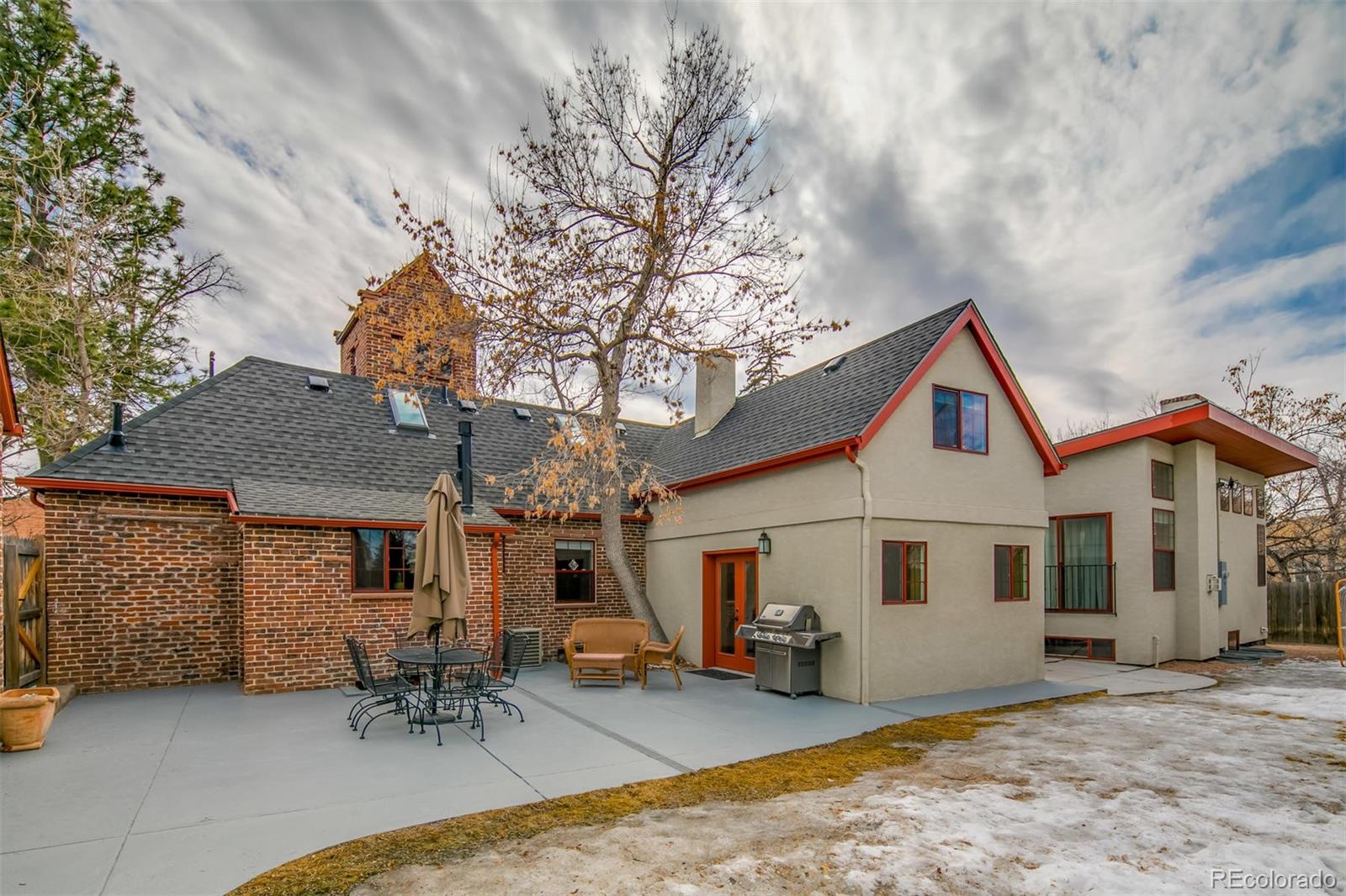 515 East Iliff Avenue Denver, CO 80210 - Photo 35 of 35 a view of a house with a patio