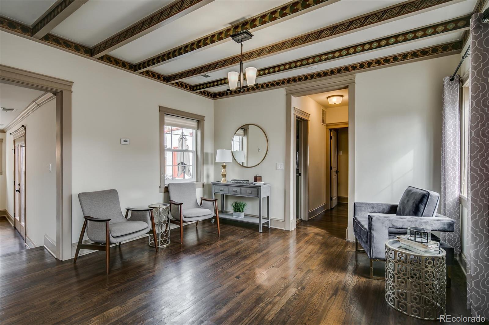 515 East Iliff Avenue Denver, CO 80210 - Photo 4 of 35 a living room with fireplace furniture and a wooden floor