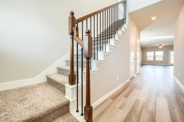 a view of a hallway view with staircase