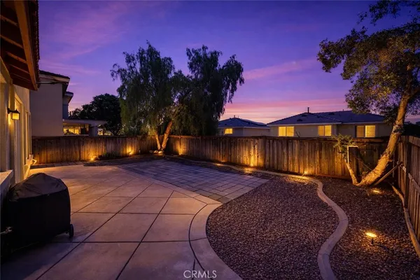 a view of a backyard with a patio