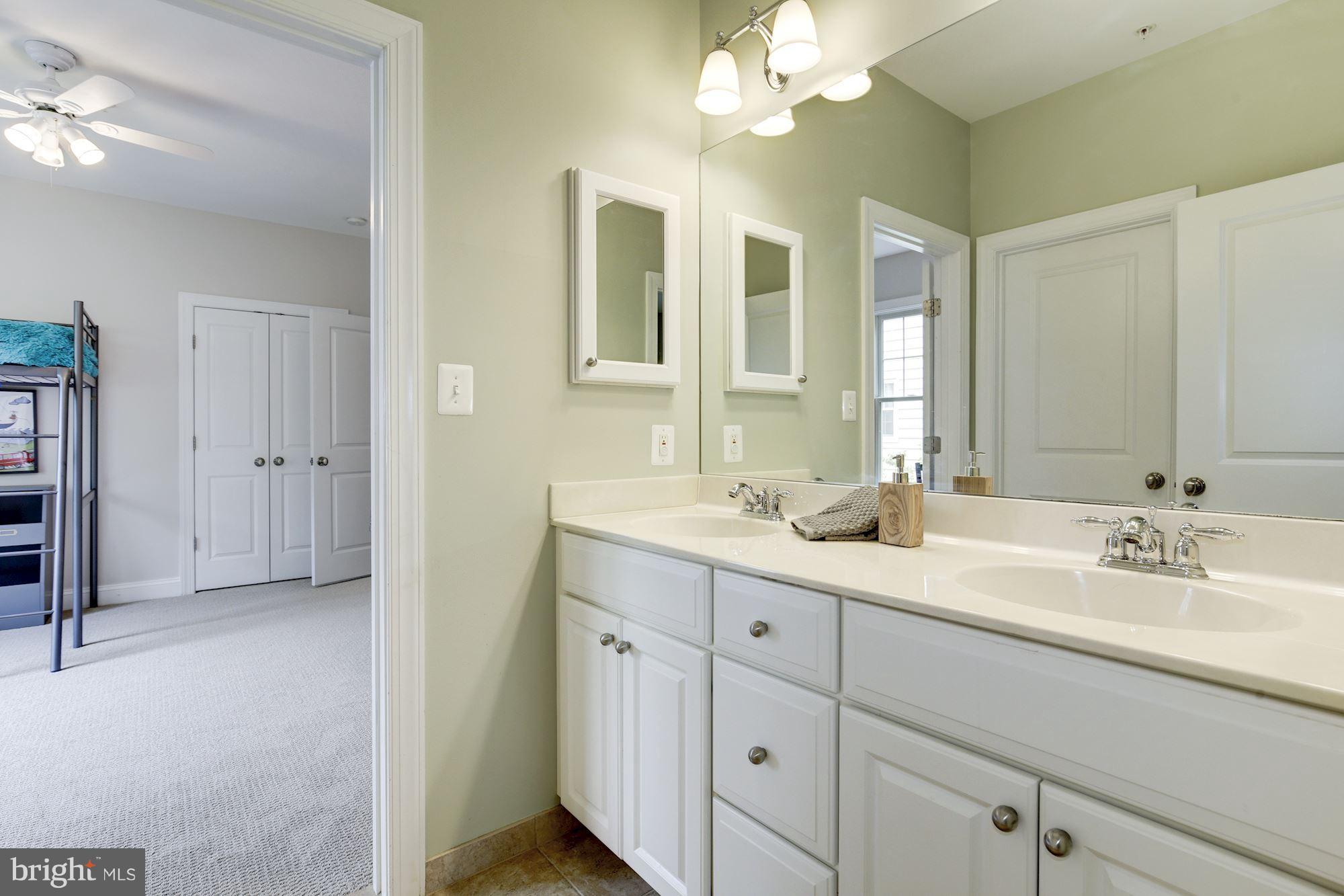 4616 Maple Avenue Bethesda, MD 20814 - Photo 13 of 30 Shared buddy bath offers separate shower/tub area