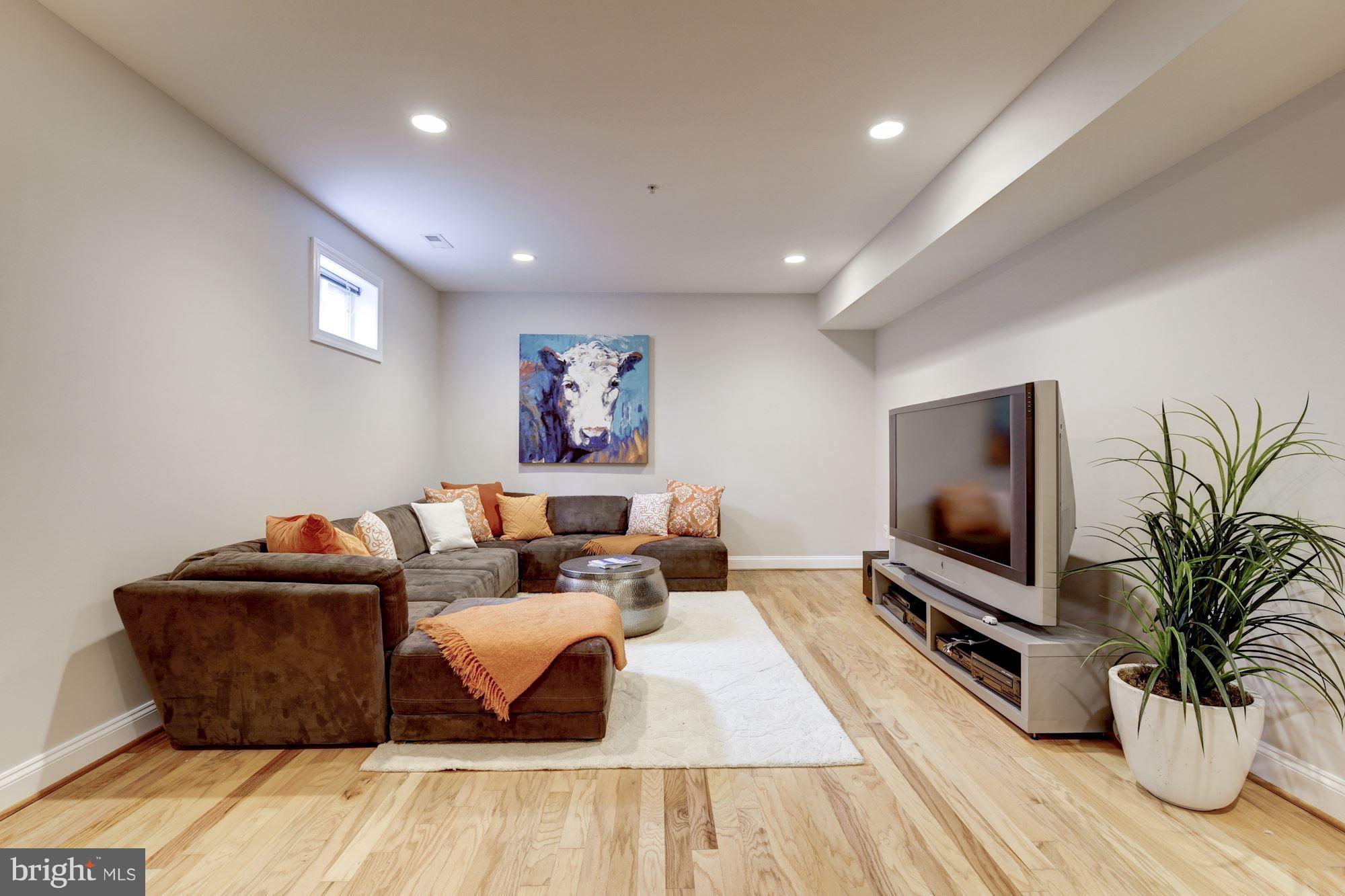 4616 Maple Avenue Bethesda, MD 20814 - Photo 21 of 30 Lower level recreation room offers HW floors