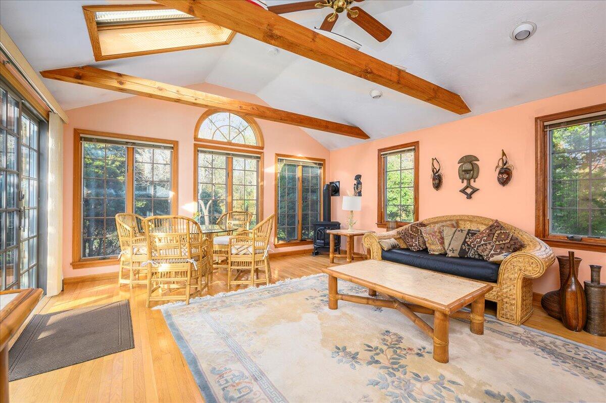 4 Faunce Mountain Road Sandwich, MA 02563 - Photo 11 of 32 a living room with furniture a wooden floor and a large window