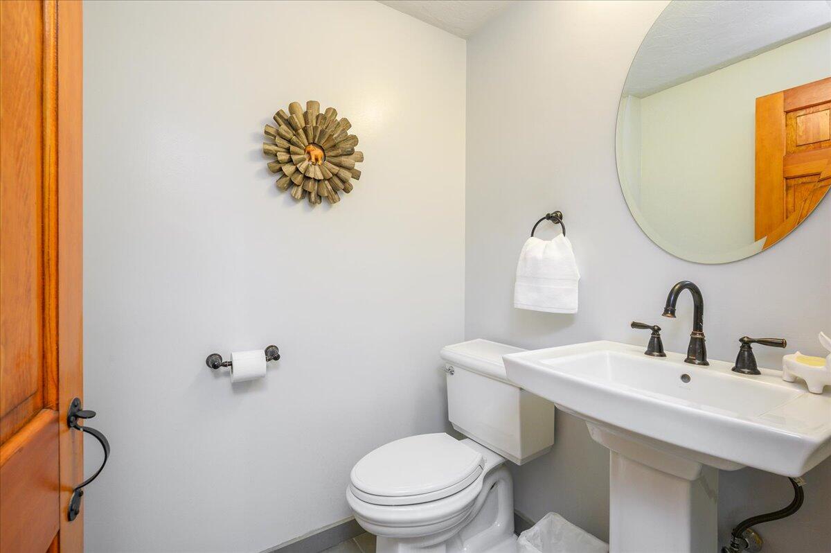 4 Faunce Mountain Road Sandwich, MA 02563 - Photo 14 of 32 a bathroom with a toilet sink and mirror