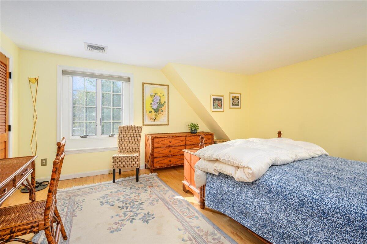 4 Faunce Mountain Road Sandwich, MA 02563 - Photo 16 of 32 a bedroom with a bed and wooden floor