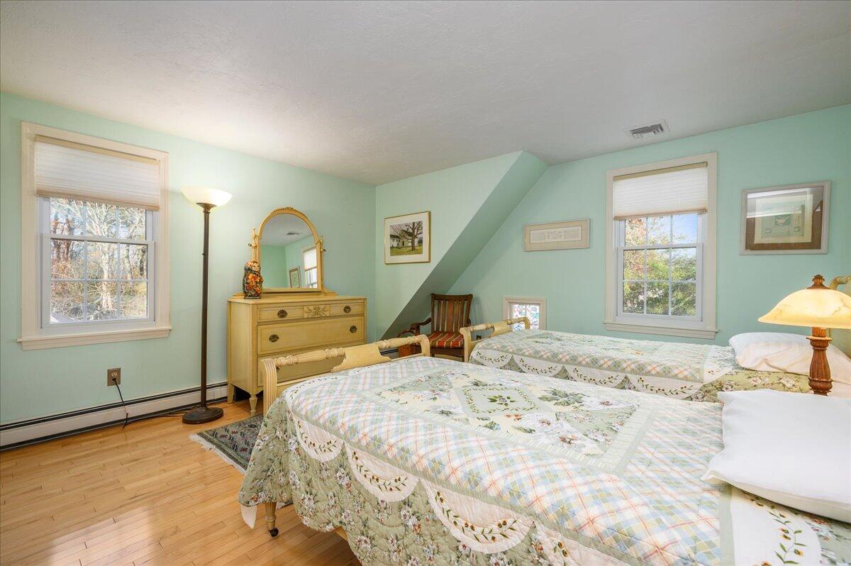 4 Faunce Mountain Road Sandwich, MA 02563 - Photo 18 of 32 a bedroom that has a bed and chair