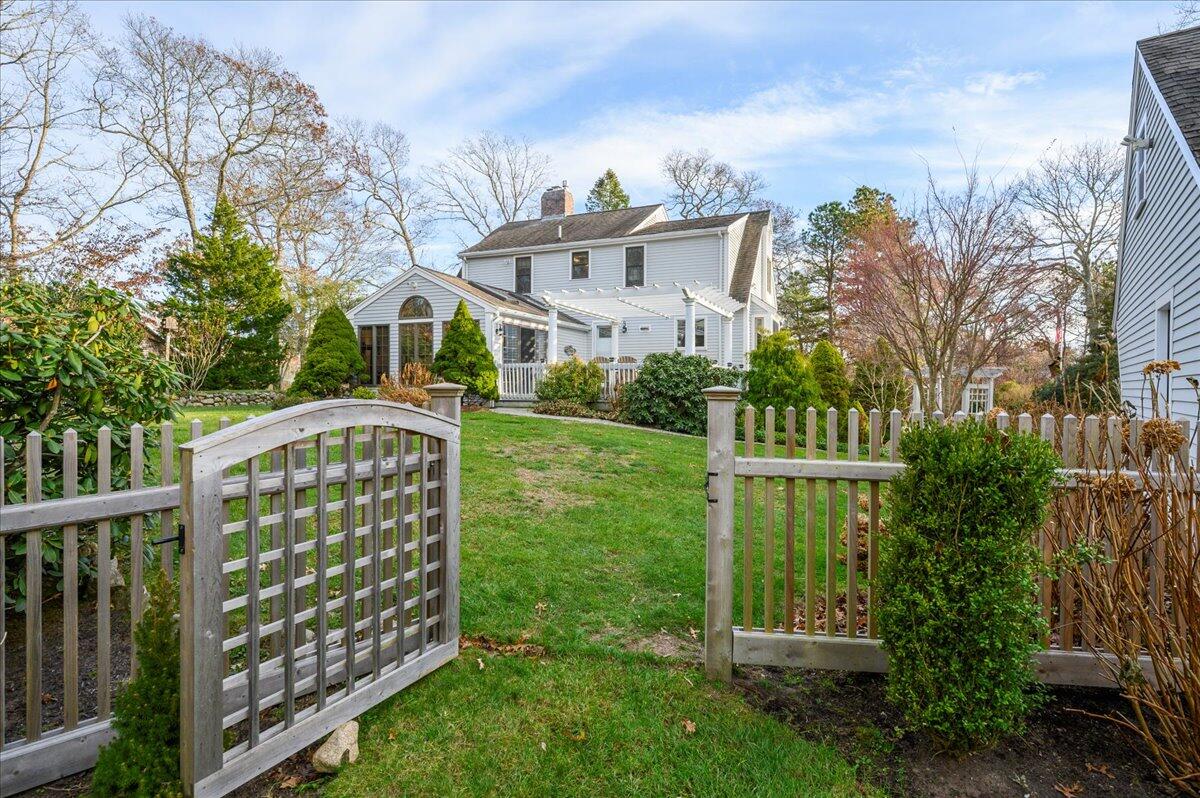 4 Faunce Mountain Road Sandwich, MA 02563 - Photo 24 of 32 a view of a house with yard and a garden