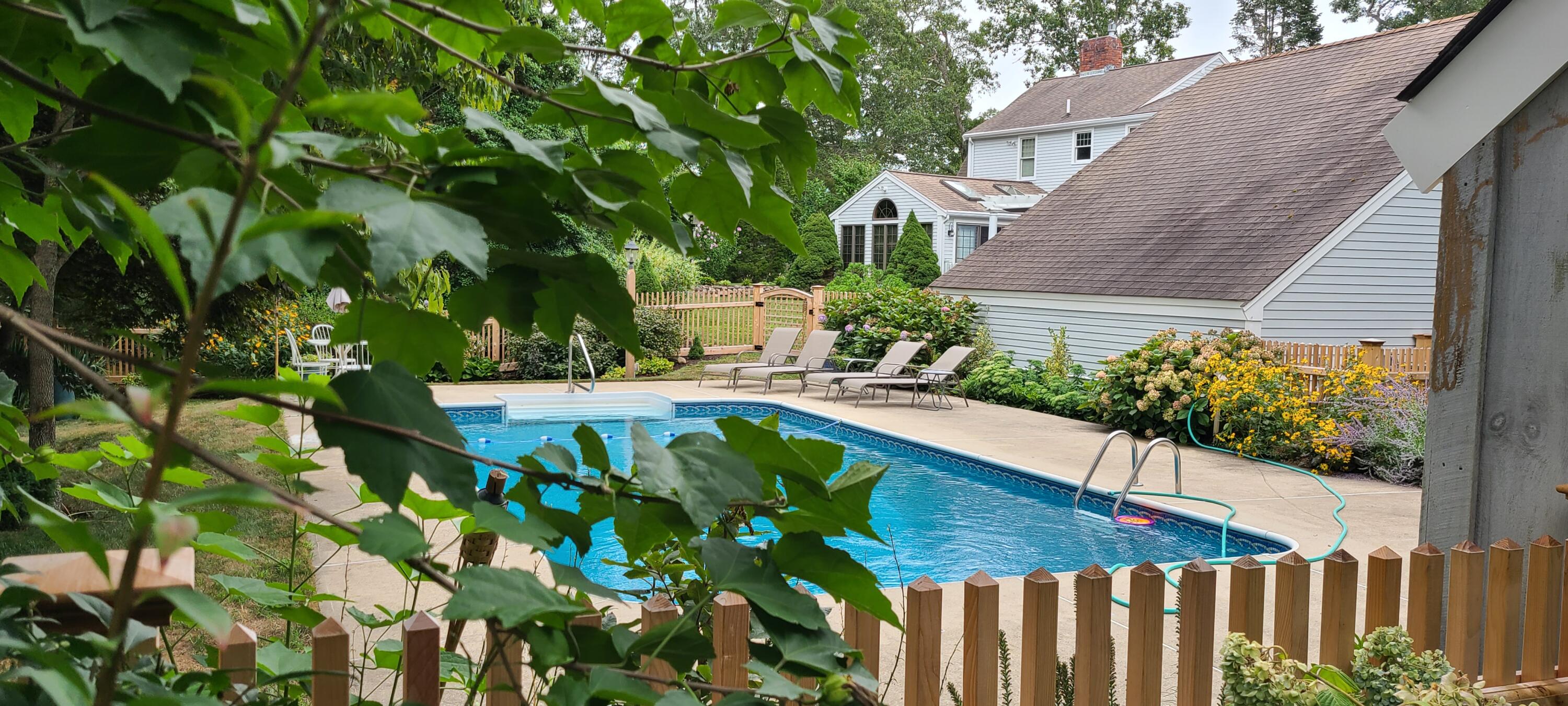 4 Faunce Mountain Road Sandwich, MA 02563 - Photo 26 of 32 a view of a house with a flower garden