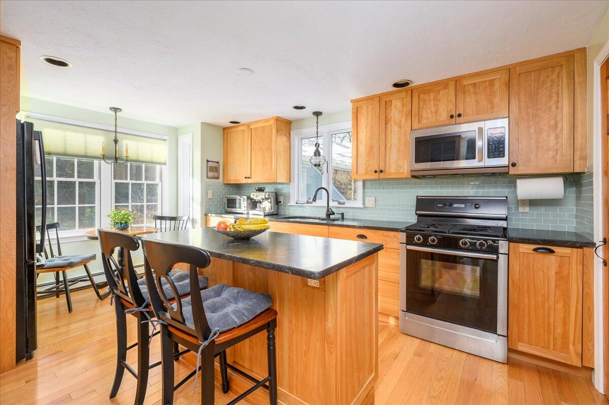 4 Faunce Mountain Road Sandwich, MA 02563 - Photo 5 of 32 a kitchen with a stove a sink and a microwave