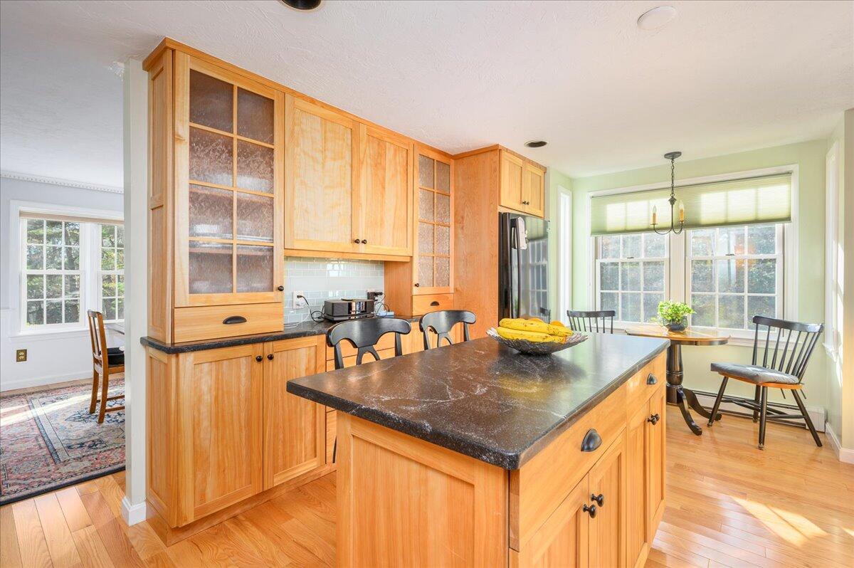 4 Faunce Mountain Road Sandwich, MA 02563 - Photo 7 of 32 a kitchen with a stove a sink and a dining table view