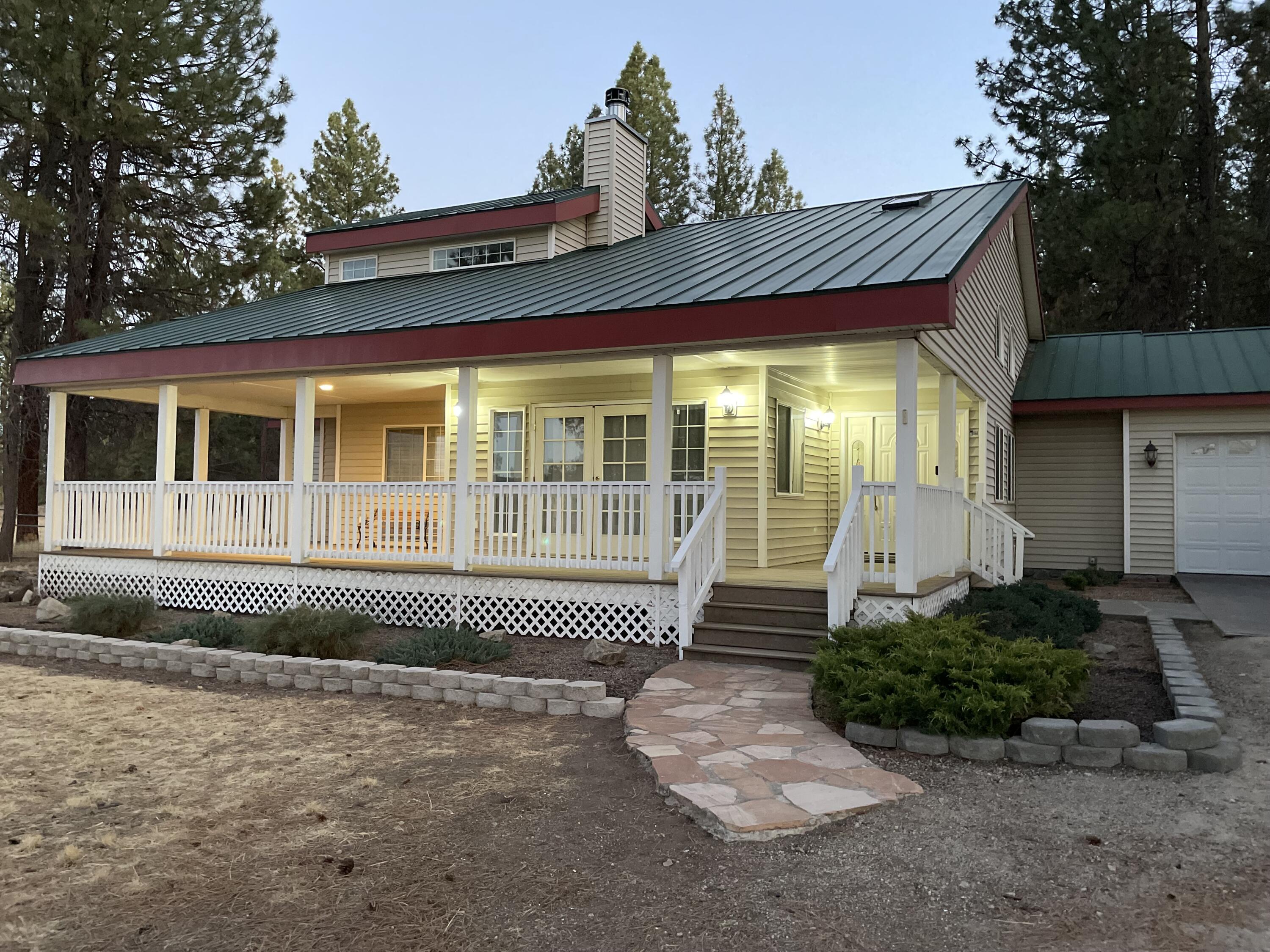 25210 Sprague River Road Sprague River, OR 97639 - Photo 19 of 79 a front view of a house with a garden