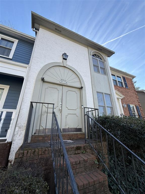 3994 Elm Street Atlanta, GA 30341 - Photo 1 of 15 a front view of a house with wooden stairs