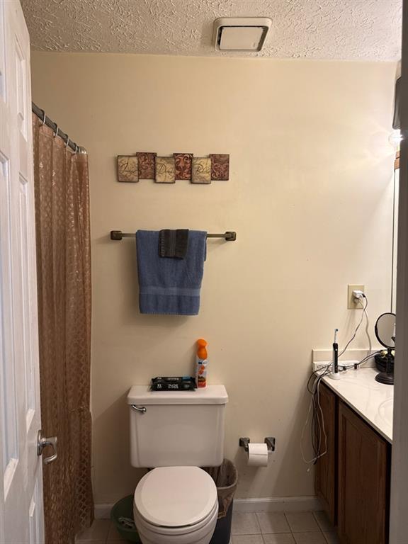 3994 Elm Street Atlanta, GA 30341 - Photo 12 of 15 a bathroom with a toilet a sink and mirror