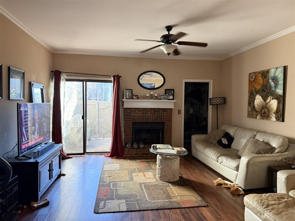 3994 Elm Street Atlanta, GA 30341 - Photo 3 of 15 a living room with furniture a fireplace and a flat screen tv