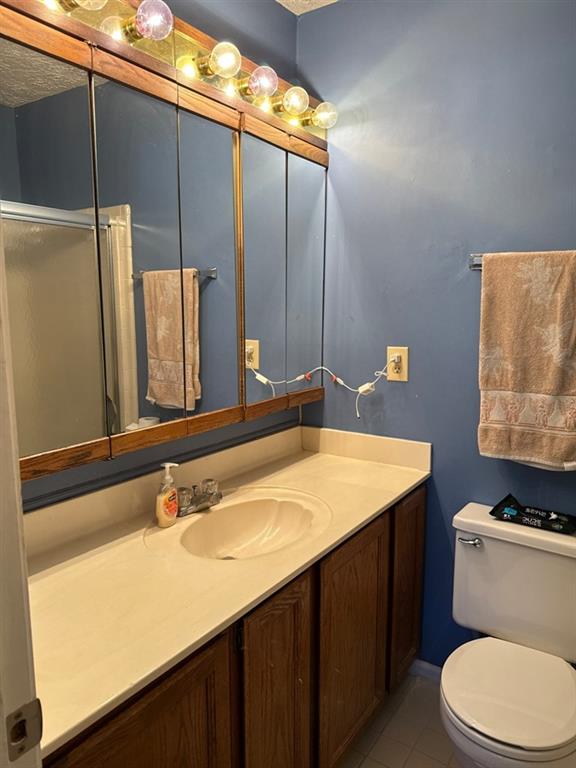 3994 Elm Street Atlanta, GA 30341 - Photo 7 of 15 a bathroom with a sink a toilet and mirror