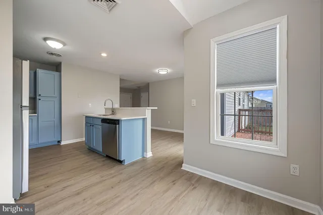 a large kitchen with a large window