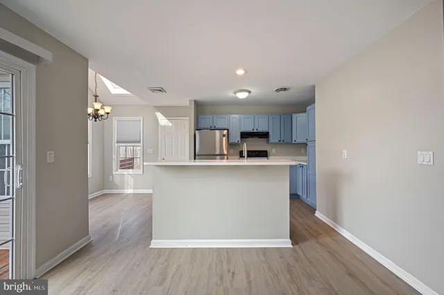 a view of kitchen with wooden floor