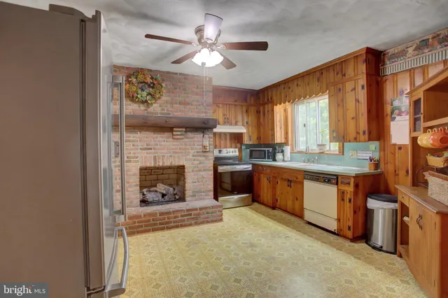 a view of a kitchen with a sink and cabinets