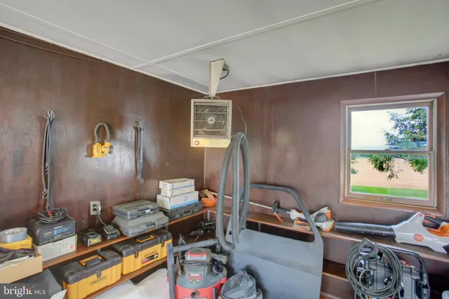 a bedroom with a bed window and a table