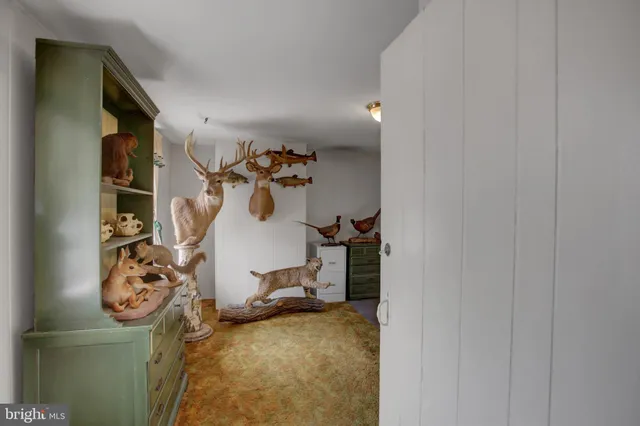 a bathroom with a sink toilet and mirror