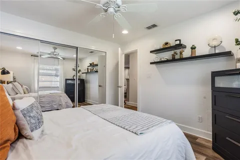 a bedroom with a bed and a dresser