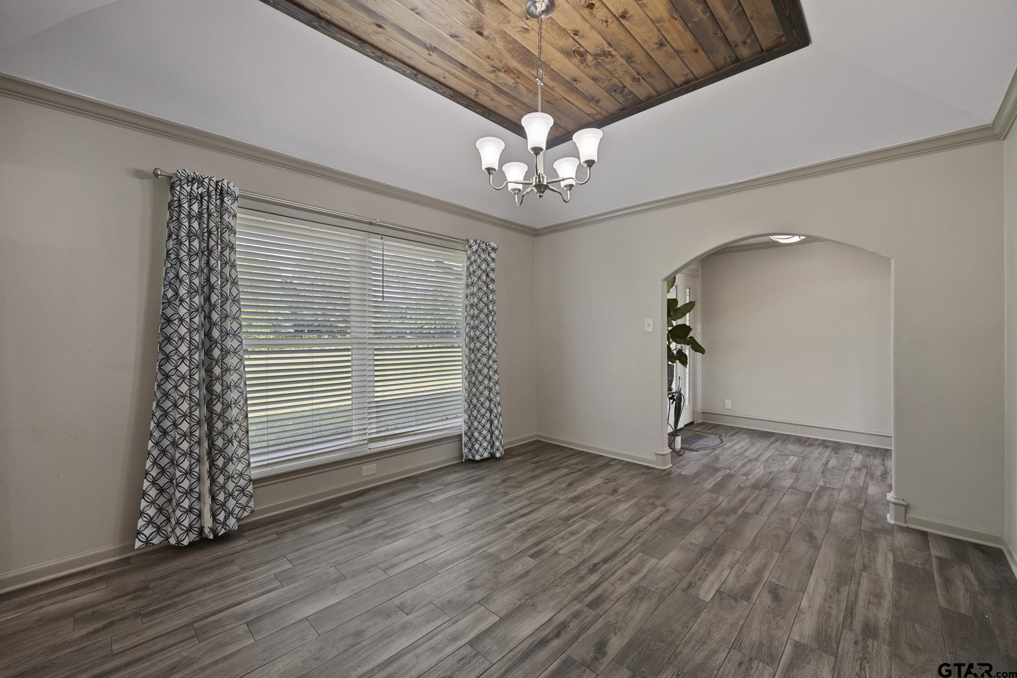 2201 Ridgley Tyler, TX 75703 - Photo 7 of 42 an empty room with wooden floor and windows