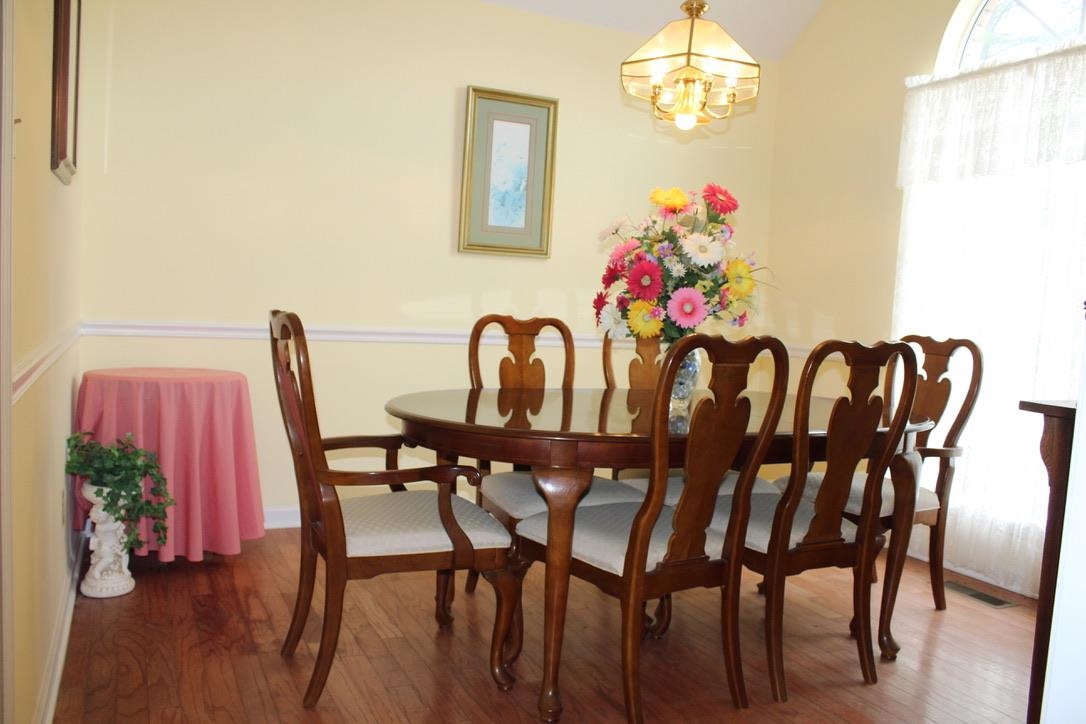954 New Hope Road Ripley, TN 38063 - Photo 11 of 35 a view of a dining room with furniture and wooden floor