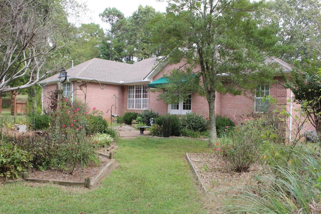 954 New Hope Road Ripley, TN 38063 - Photo 23 of 35 a front view of a house with a yard
