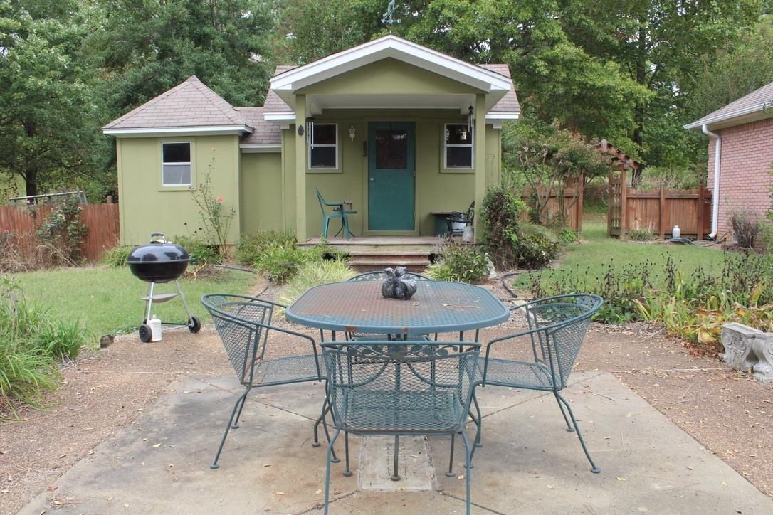 954 New Hope Road Ripley, TN 38063 - Photo 25 of 35 a backyard of a house with table and chairs