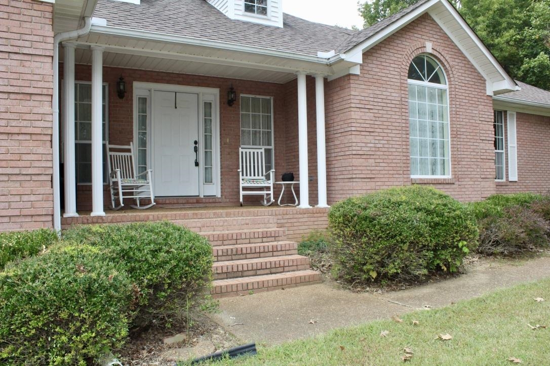 954 New Hope Road Ripley, TN 38063 - Photo 33 of 35 a front view of a house with garden