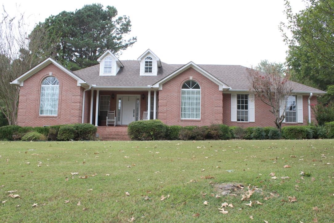 954 New Hope Road Ripley, TN 38063 - Photo 34 of 35 a front view of a house with a yard and garage