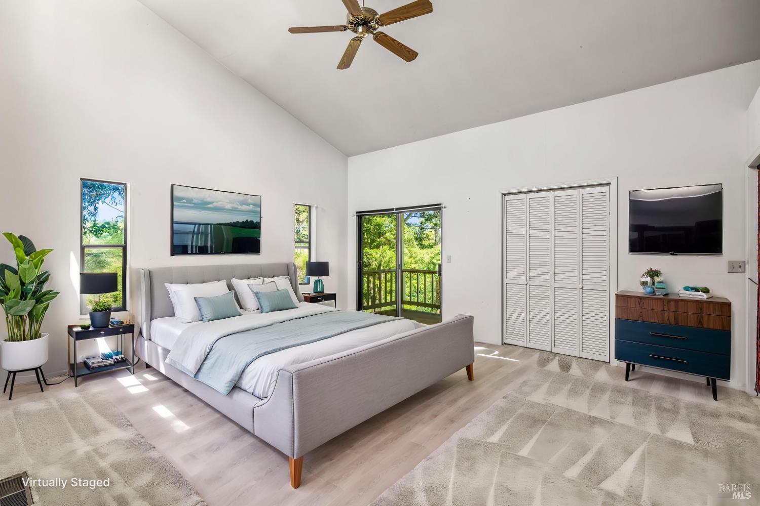 625-629 Hill Road Angwin, CA 94508 - Photo 48 of 64 a bedroom with a bed and a flat screen tv