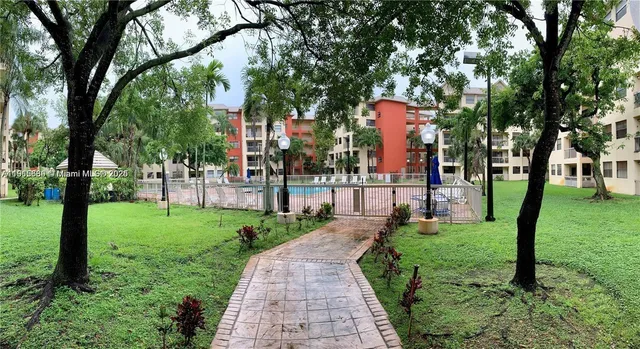 a view of a park with large trees