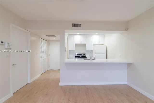 a view of a kitchen with a sink