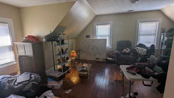 a room with furniture and wooden floor