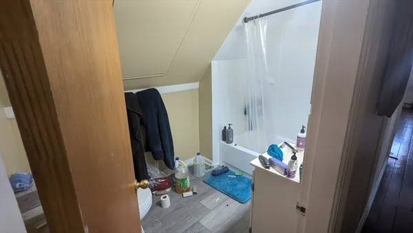 a room with furniture a wooden floor and a window