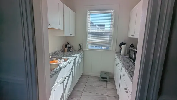 a bathroom with sink and mirror