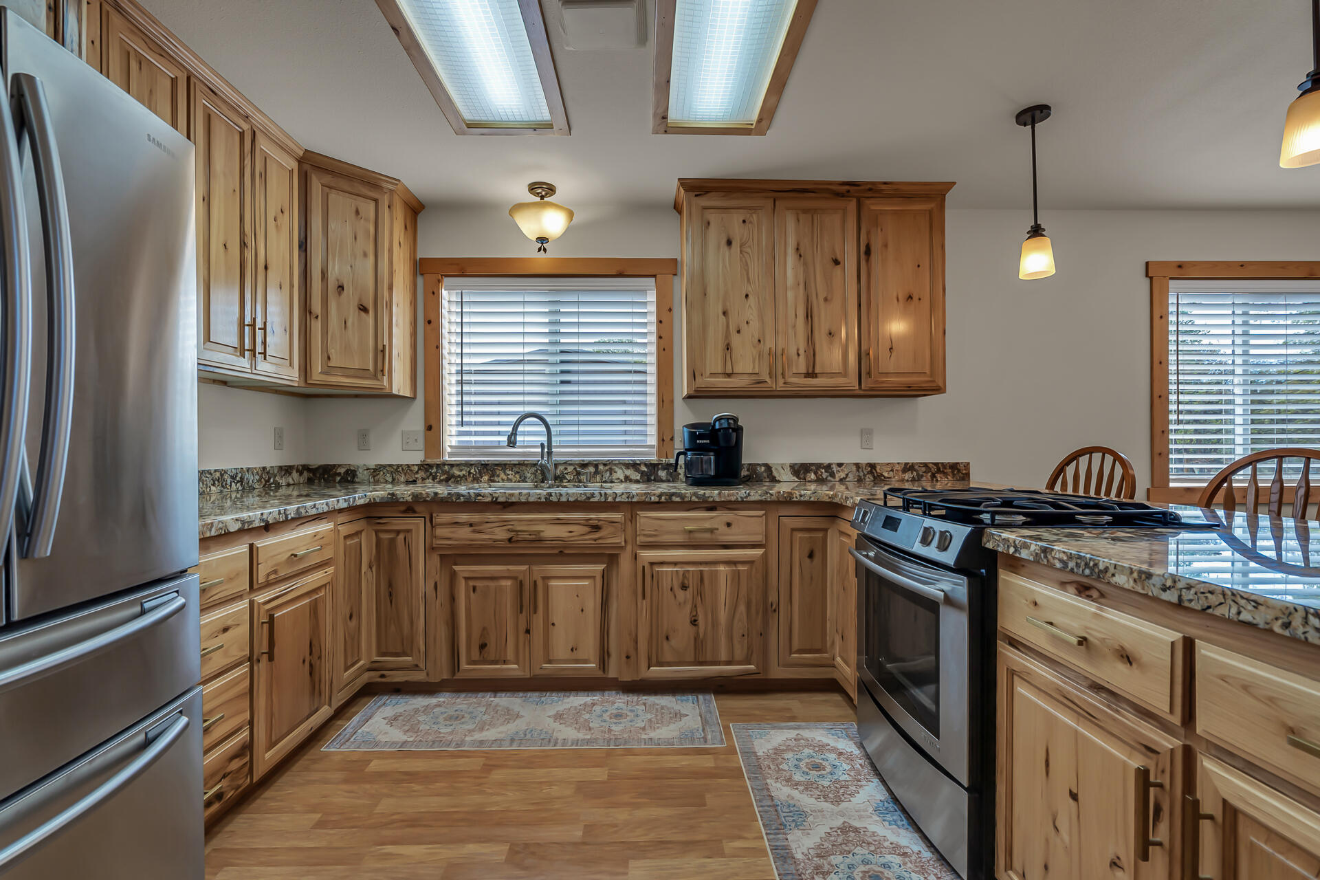 29101 Day Road McArthur, CA 96056 - Photo 16 of 48 a kitchen with stainless steel appliances granite countertop a sink stove and refrigerator