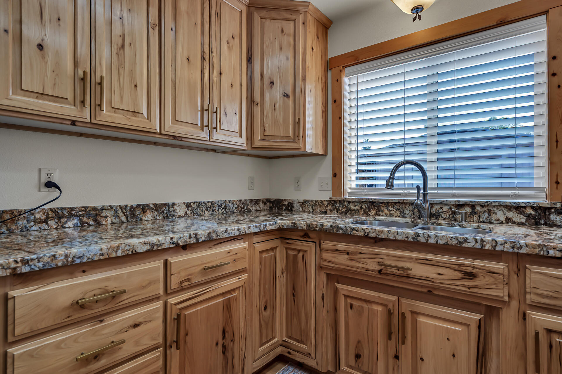 29101 Day Road McArthur, CA 96056 - Photo 18 of 48 a kitchen with granite countertop stainless steel appliances white cabinets and a sink