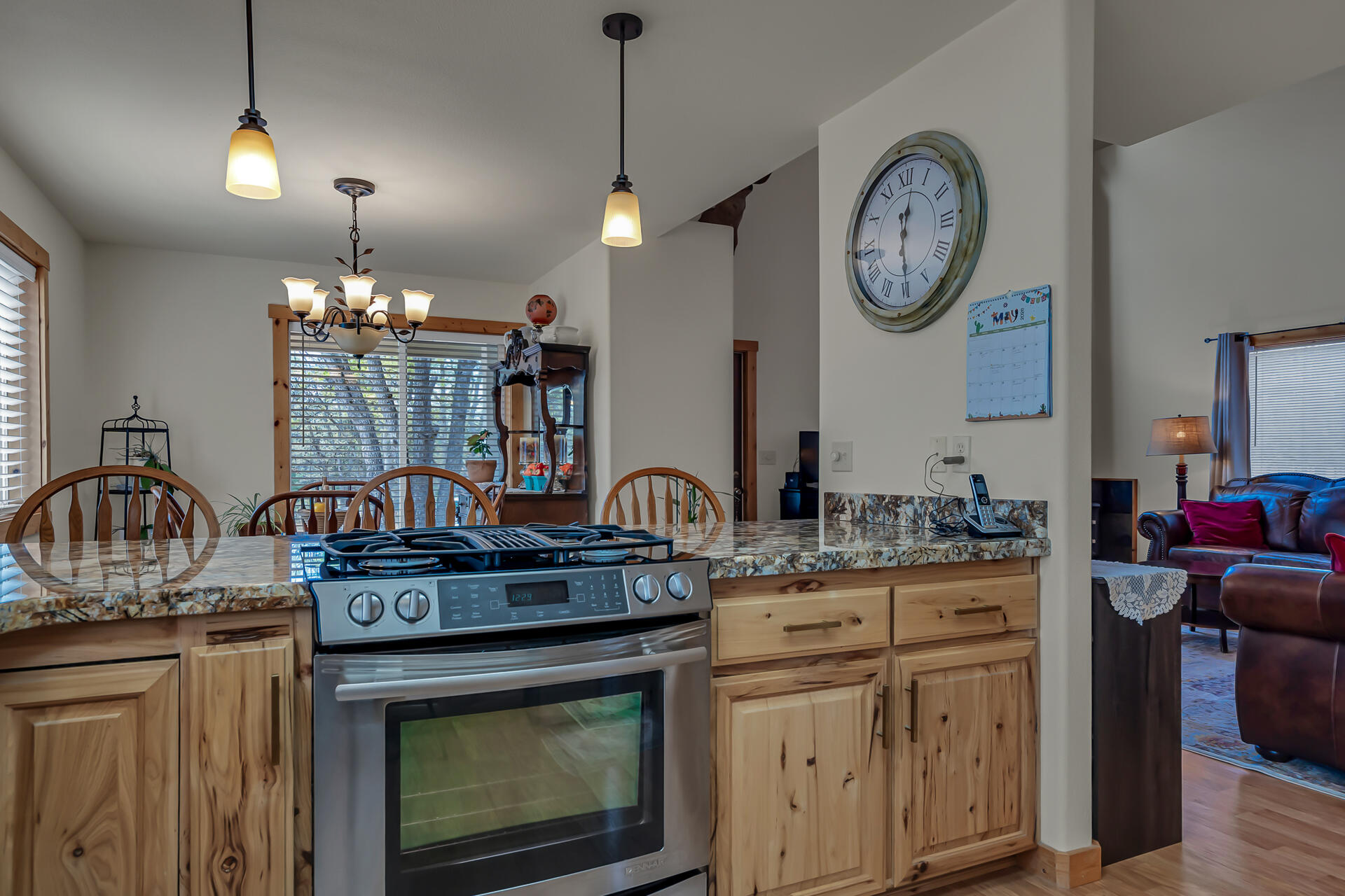 29101 Day Road McArthur, CA 96056 - Photo 20 of 48 a kitchen with kitchen island a stove a sink and a chandelier