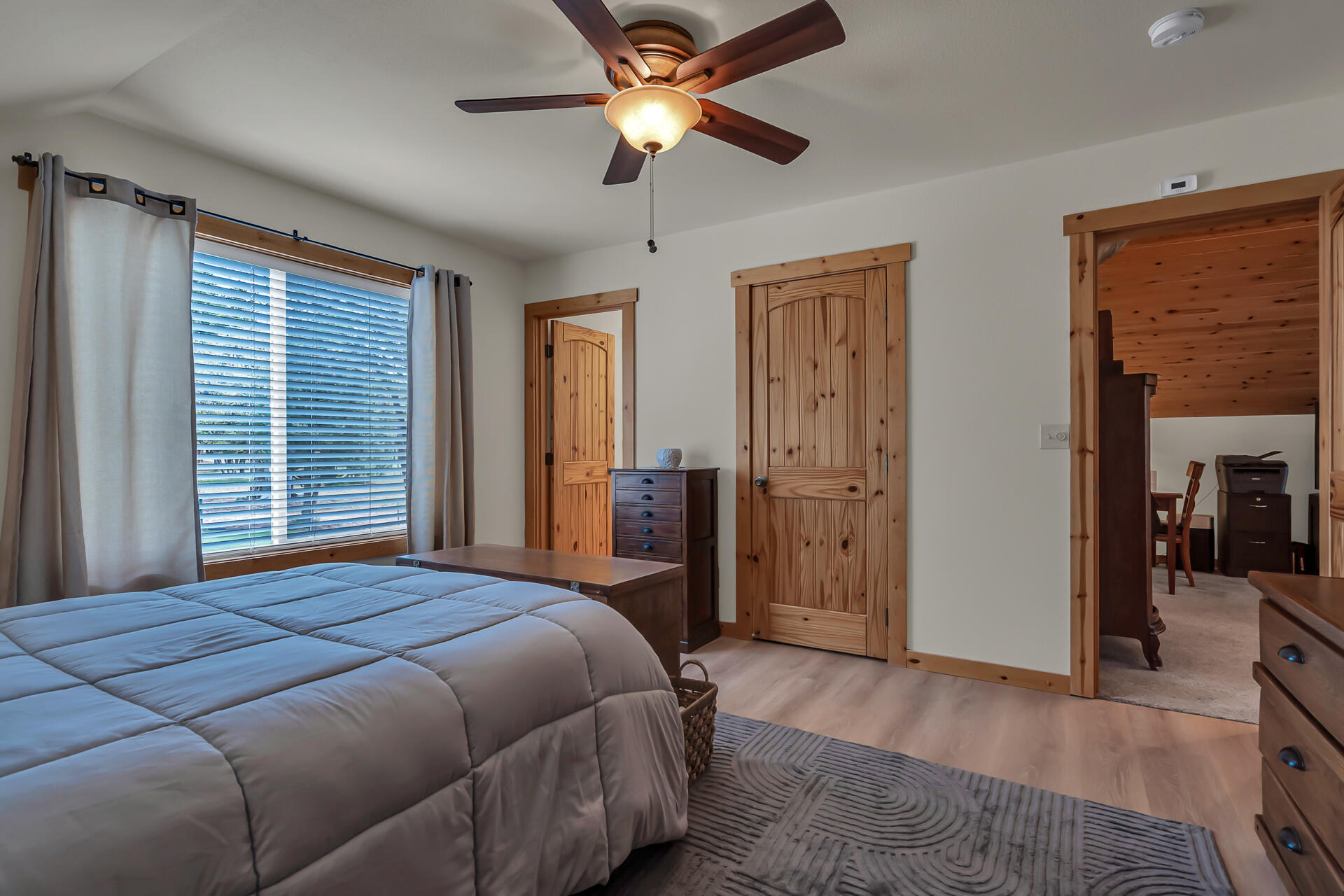 29101 Day Road McArthur, CA 96056 - Photo 33 of 48 a bedroom with a bed and a chandelier