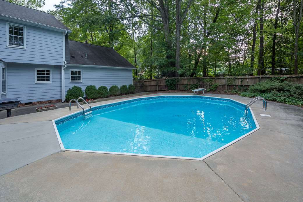 6700 Colony Court Raleigh, NC 27613 - Photo 17 of 21 Large fenced back yard, nicely landscaped with in-ground pool! Yard