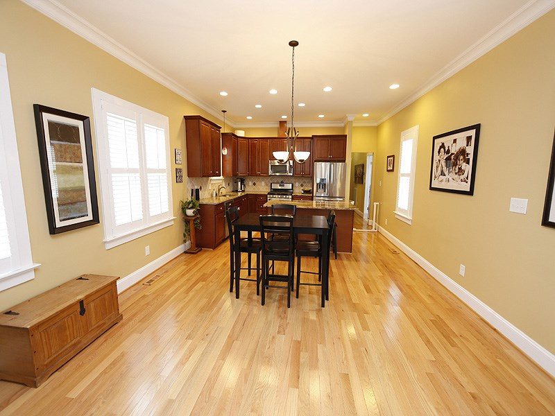 514 Worth Street Raleigh, NC 27601 - Photo 5 of 17 Open Family Room/Dining Room concept extends the beautiful hardwoods and trim details. Dining Room