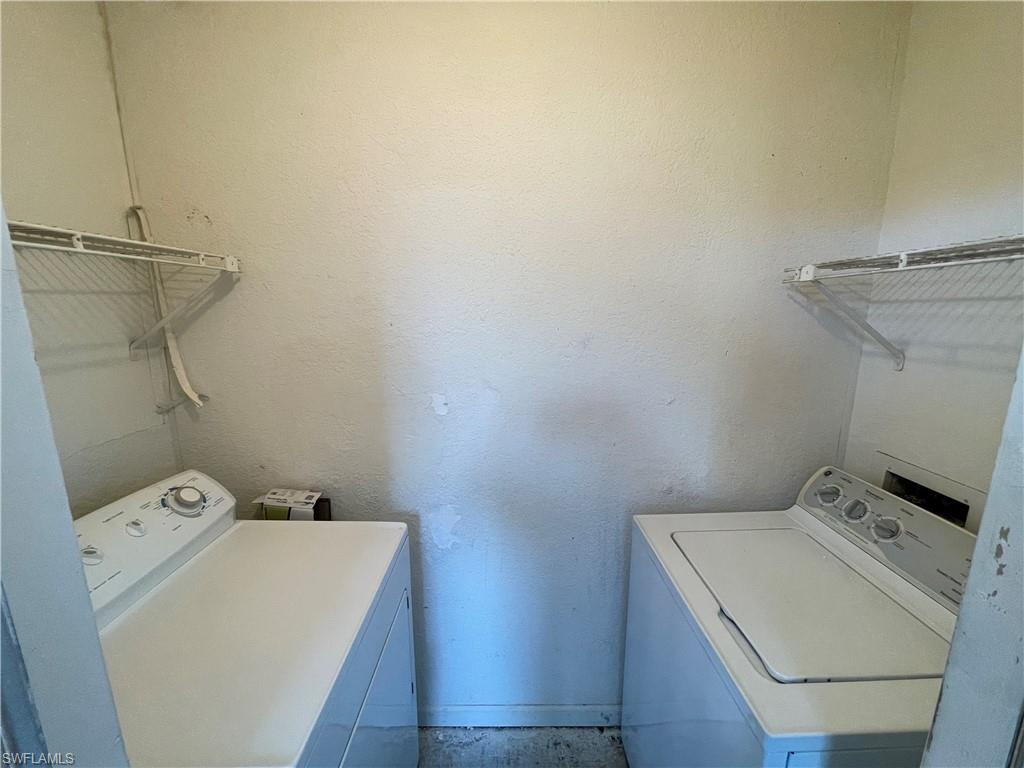 13555 Eagle Ridge Drive, Unit 925 Fort Myers, FL 33912 - Photo 9 of 15 a utility room with dryer and washer