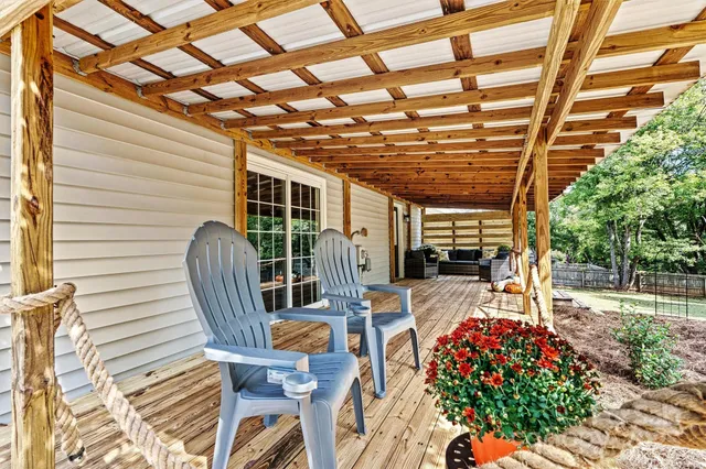 a view of a chairs and table in the patio