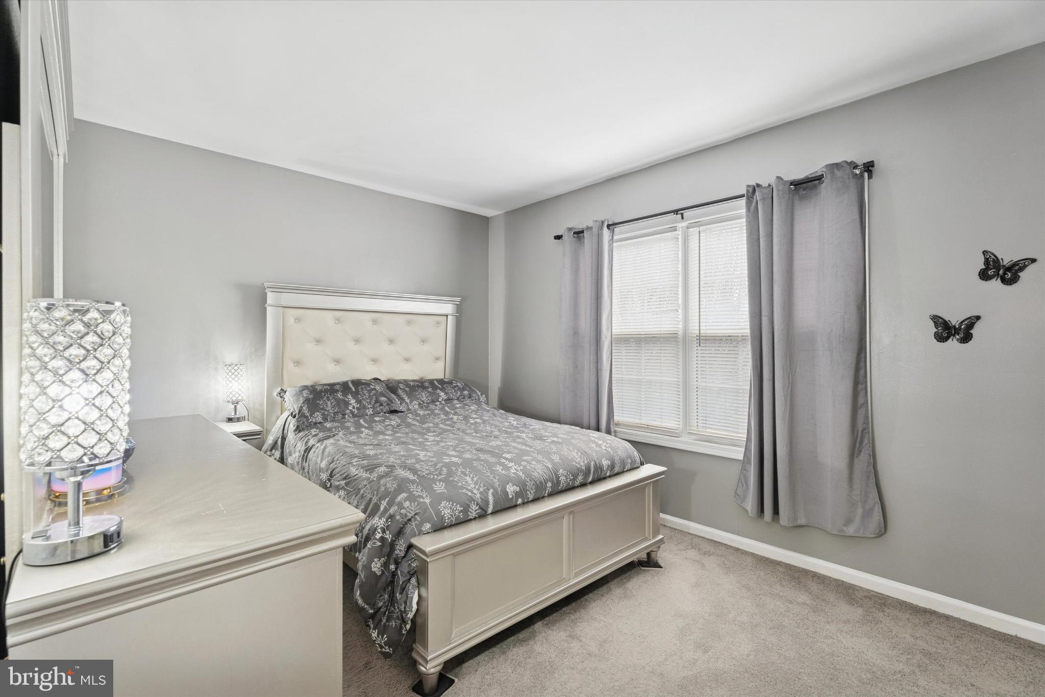 8319 Woolston Avenue Philadelphia, PA 19150 - Photo 13 of 30 a bedroom with a bed and a window