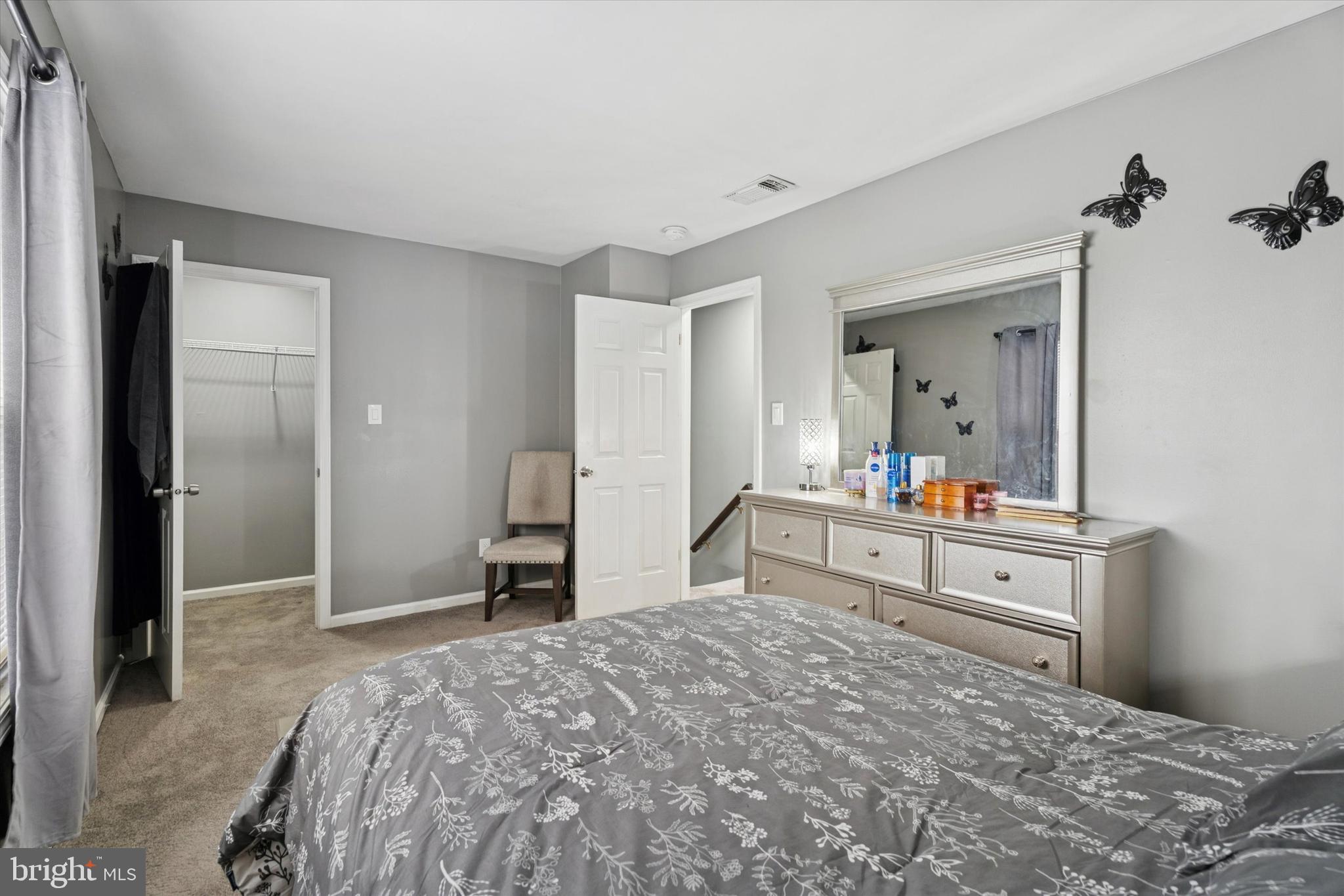 8319 Woolston Avenue Philadelphia, PA 19150 - Photo 14 of 30 a bedroom with a bed and a large mirror on dresser