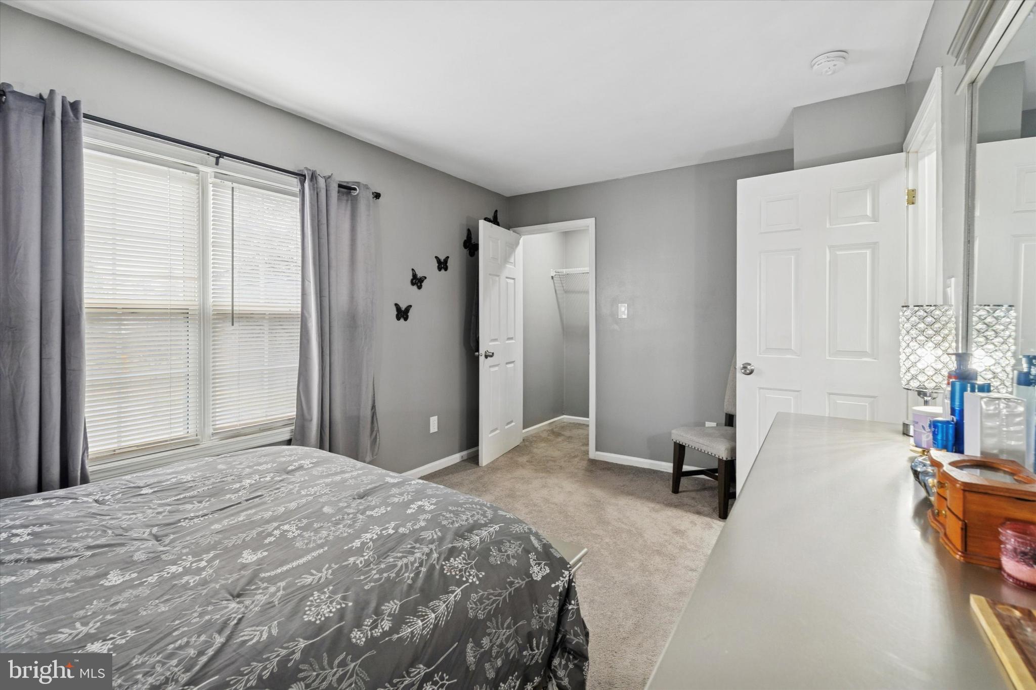 8319 Woolston Avenue Philadelphia, PA 19150 - Photo 15 of 30 a bedroom with a bed and a window